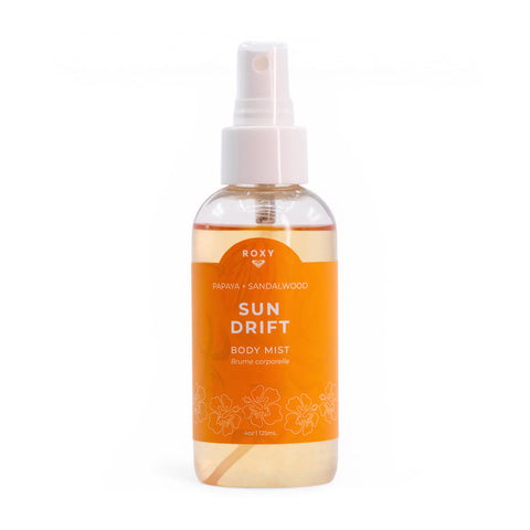 A 4 oz (125 ml) clear spray bottle of Roxy Sun Drift Body Mist with hibiscus, papaya, and sandalwood notes features a white cap and an orange floral label.